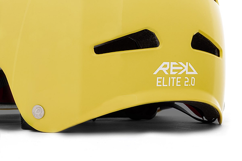 Close-up of a REKD Elite 2.0 Skate / Scooter Helmet in gloss yellow, featuring two ventilation slots and the REKD brand logo in white on the side.