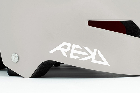 Close-up of the REKD Elite 2.0 Skate / Scooter Helmet in Grey / Yellow, featuring a lightweight design, black vent, bold white "REKD" logo, and quality metal screw detail—showcasing the craftsmanship of this certified REKD helmet.
