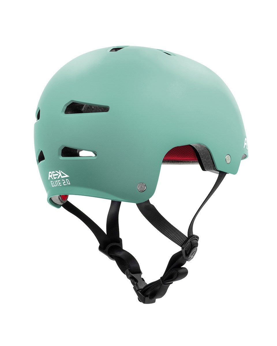 The REKD Elite 2.0 Skate / Scooter Helmet in matt teal features multiple vents, black adjustable straps, and "REKD Elite 2.0" in white on the side—perfect lightweight protection for skating or scooter riding enthusiasts.