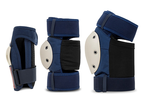 Three REKD Shield Triple Skate Protection Pad Sets in blue, featuring black accents and white hard shells, are displayed from multiple angles against a white background—a versatile protective gear set by REKD, ideal for action sports.
