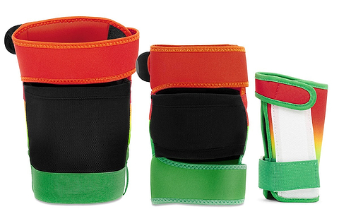 Three vibrant REKD Shield Triple Skate Protection Pad Sets in Fade Orange/Green are displayed upright, designed for action sports protection. Featuring secure Velcro closures and versatile wrist guards, these pads are shown from multiple angles against a white background.