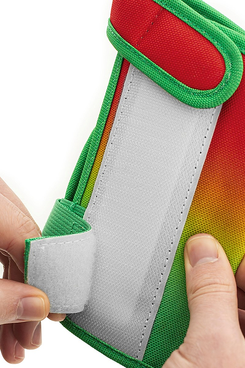 Close-up of hands opening the REKD Shield Triple Skate Protection Pad Set pouch by REKD, featuring a vibrant fade orange and green exterior with a Velcro fastener—perfect for storing your wrist guards or other action sport protection gear.