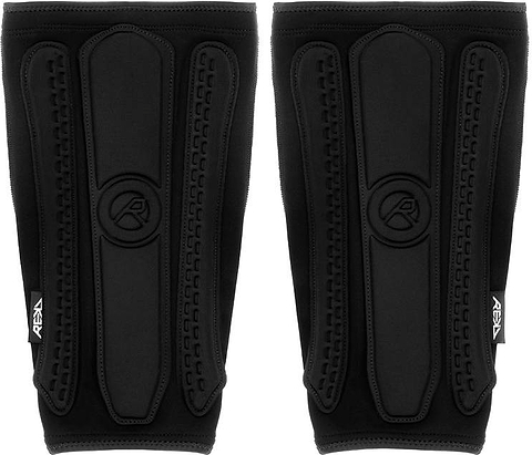 REKD Energy Covert Long Shin Skate Protection Guards in slim black, featuring padded vertical segments with a logo embossed in the center.