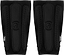 REKD Energy Covert Long Shin Skate Protection Guards in slim black, featuring padded vertical segments with a logo embossed in the center.
