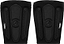 A pair of black REKD Energy Covert Short Shin Skate Protection Guards featuring vertical padding and circular logos on the front for slim impact protection.