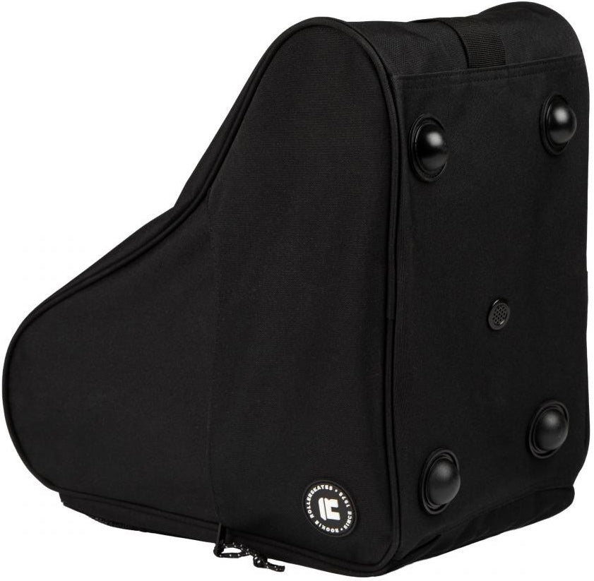The Rookie Classic 78 Skate Bag - Black by Rookie is a wedge-shaped, fabric skate bag featuring four round feet on one side and a small logo patch near the zipper at the bottom corner. Designed to securely carry skates, this upright bag is shown against a plain white background.