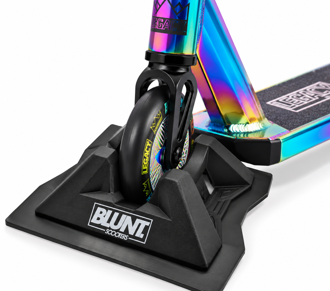 A close-up of a 30mm wide scooter wheel in a Blunt Envy Scooter Stand V2 - Black, with part of the deck and LEGACY branding visible.