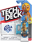 Tech Deck 96mm M61 Fingerboard - Push featuring a cartoon character with large eyes, packaged with a blue plastic barrier and a sticker sheet labeled “PUSH.”