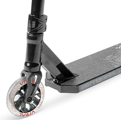 Close-up of the Madd Gear Viral Extreme Complete Stunt Scooter - Black Shadow, featuring a textured deck, sturdy fork, and a white wheel with black spokes and red "Viral" branding—perfect for skatepark riders.
