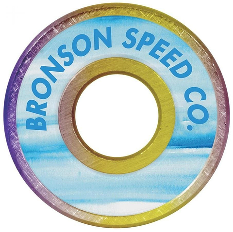 The Bronson Speed Co. Chris Cookie Colbourn Pro G3 Skateboard Bearings feature a blue and yellow gradient design with "Bronson Speed Co." printed on the edge, ideal for fans seeking both style and performance in their ride.