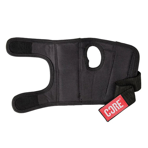 The CORE Classic Skate Protection Wrist Guards in black feature a neoprene construction with an open thumb hole and an adjustable strap. They include a red tag that reads "CORE Protection" and provide support and compression with a reinforced splint for added stability, offering the protection of skate wristguards.