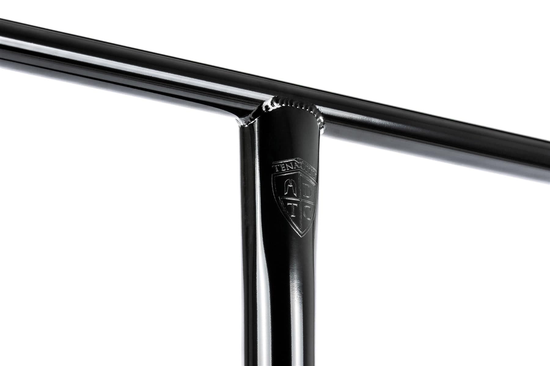 Close-up of the Ethic DTC Tenacity V2 Steel HIC Stunt Scooter T-Bars in Black Mirror (720mm x 600mm), featuring a durable welded joint and embossed shield logo with "TENACITY" and a cross—ideal for pro scooters.