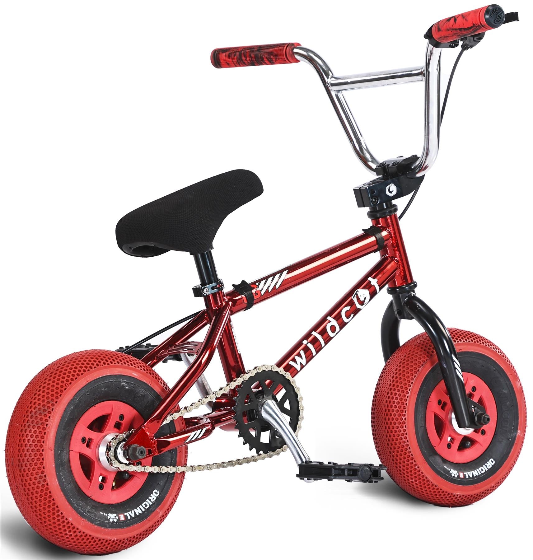 The Wildcat OG 3A Mini BMX Bike in Royal Red features thick, textured PRO Street 65PSI tyres, black pedals and seat, CNC aluminium rims, and bold red/black grips. The shiny red frame displays "wildcat" in white.