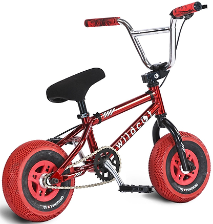 The Wildcat OG 3A Mini BMX Bike in Royal Red features thick, textured PRO Street 65PSI tyres, black pedals and seat, CNC aluminium rims, and bold red/black grips. The shiny red frame displays "wildcat" in white.