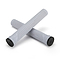 Two grey bicycle handlebar grips, crafted for ultimate comfort, are crossed against a pristine white background. Both Drone Acolyte Grips feature sleek black end caps for a striking contrast.