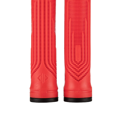 Close-up of two red Drone Acolyte Red Stunt Scooter Grips - 180mm by Drone, featuring Comfort Max silicone. These cylindrical grips display textured patterns and black base rings, with vertical grooves and a futuristic geometric design, offering improved grip and style.