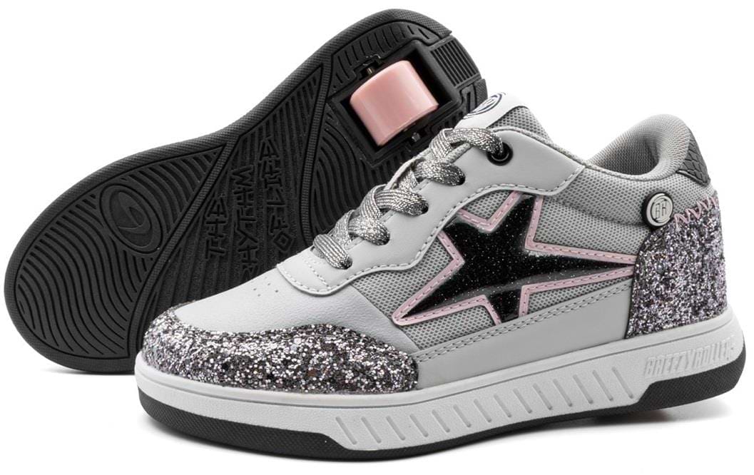 The Breezy Rollers Star Shoes - Silver / Grey feature a patented wheel system, silver glitter accents, gray laces, and a black star with a pink outline. One shoe is upright; the other displays the sole and black wheel.