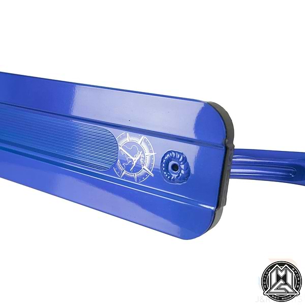 Close-up of the Madd Gear MGP VX9 Blue Jordan Clark Signature Stunt Scooter Deck (4.5" x 19.5"), showing its smooth metal finish and limited-edition engraved logo with a bird and star, inspired by pro rider Jordan Clark.