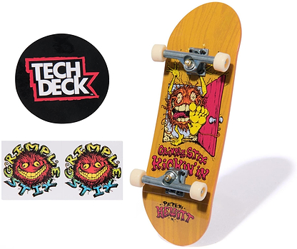 The Tech Deck 96mm M57 Fingerboard - Grimple Stix features a colorful monster graphic, white wheels, silver trucks, two Grimple Stix logo stickers, and a round black Tech Deck sticker—ideal for skateboard collectible fans.