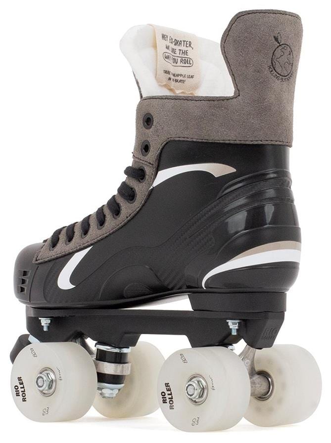 The Rio Roller Flow Hockey Quad Roller Skates in black feature a side view with gray tones, four white wheels, and black laces. The design includes a sleek wave pattern with the logo clearly visible on the tongue and heel as part of the Sustainable Collection by Rio Roller.