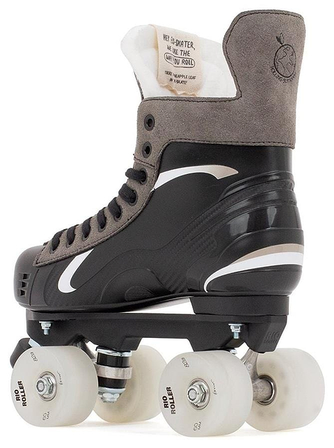 The Rio Roller Flow Hockey Quad Roller Skates in black feature a side view with gray tones, four white wheels, and black laces. The design includes a sleek wave pattern with the logo clearly visible on the tongue and heel as part of the Sustainable Collection by Rio Roller.