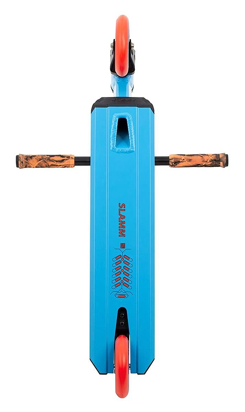 A top-down view reveals the Slamm Classic Mini Complete Stunt Scooter in blue, featuring orange wheels and handlebars with a textured brown grip, designed for freestyle scootering. The brand name "Slamm" is clearly visible on the deck.