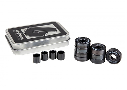 A tin box marked with "Birdhouse" sits adjacent to both stacked and separate premium skateboard bearings and spacers. The ABEC 7 bearings prominently feature the label "Birdhouse ABEC Seven." The image, set against a pristine white background, accentuates the quality of the Birdhouse ABEC 7 Black Skateboard Bearings - 8 Pack.