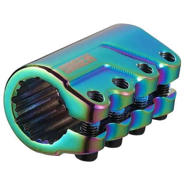 A multi-colored metallic BMX stem, similar to the Blunt Envy Omen 4 Bolt Oversized SCS Stunt Scooter Clamp in Oil Slick Neochrome, features a polished, iridescent finish with several bolt holes and a textured inner surface. Its reflective surface displays hues of blue, green, and purple.
