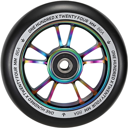 Close-up of a Blunt Envy 100mm stunt scooter wheel showcasing an aluminium core with an oil slick neochrome finish. The outer black rim is inscribed with "ONE HUNDRED X TWENTY FOUR MM 86A," and it is equipped with smooth ABEC 9 bearings for optimal performance.