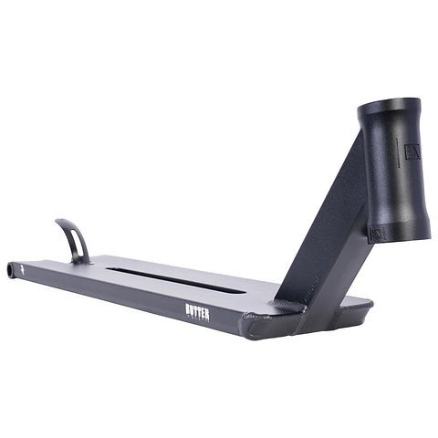 The UrbanArtt Butter Black Stunt Scooter Deck, measuring 5.5" x 22", showcases a close-up view of its black deck with a cutout design, complemented by a raised front neck and handlebars attachment area. The brand name "BUTTER" is prominently printed on the side. This scooter deck features buttery smooth lines combined with Cro-Mo durability, offering both style and resilience.