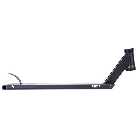 The UrbanArtt Butter Black Stunt Scooter Deck, measuring 5.5" x 22", features a right-angled neck and an integrated head tube, prominently displaying "BUTTER" in white on the side. Its design supports Cro-Mo durability with a smooth finish, and it is equipped with a reliable brake flap on the rear for quick stopping power.
