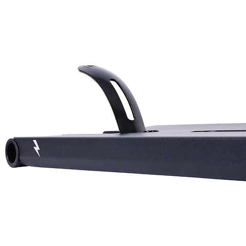 A close-up of the UrbanArtt Butter Black Stunt Scooter Deck, measuring 5.5" x 22", showcases a vertical handle and buttery smooth finish with a white lightning bolt logo. Known for its sleek and minimalist design, the deck is partially visible against a plain white background.