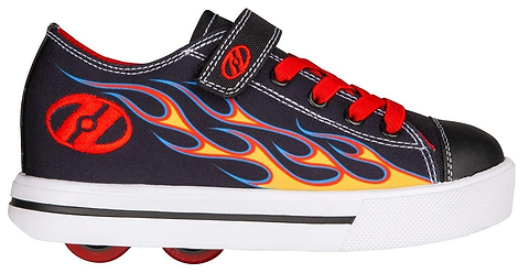 The Heelys Snazzy X2 Boys Shoes in black with yellow and red flame details feature a canvas upper, red laces, Velcro strap, ABEC 3 bearings, and red wheels built into the sole.