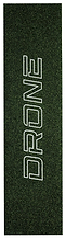 The Drone Prism Glitter Stunt Scooter Griptape - Green is a textured mat with "DRONE" printed vertically in bold white letters, featuring colored silica grit for a prismatic effect.
