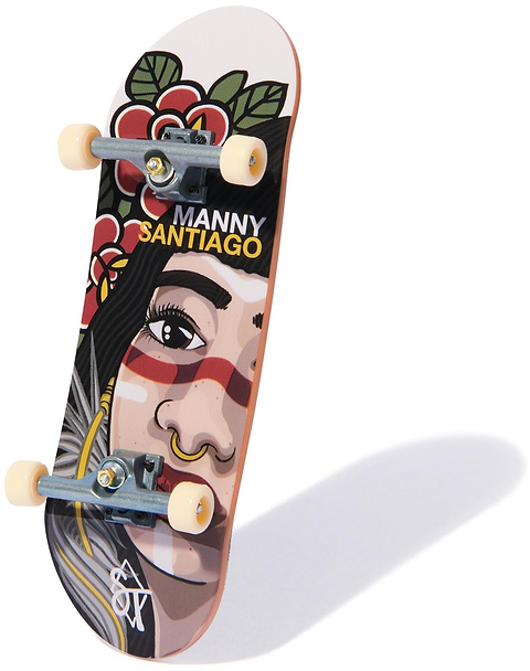 The Tech Deck 96mm M54 Fingerboard - Sandlot Times features a unique skateboard-inspired design with artwork of a woman's face with red face paint, nose ring, and floral details. "Manny Santiago" is printed above the illustration.