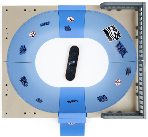 The Tech Deck X-Connect Fingerboard Daewon Mega Bowl is a blue and gray oval skatepark with ramps, rails, and graffiti. A black Daewon Song-inspired Tech Deck fingerboard sits in the center. Brand: Tech Deck.