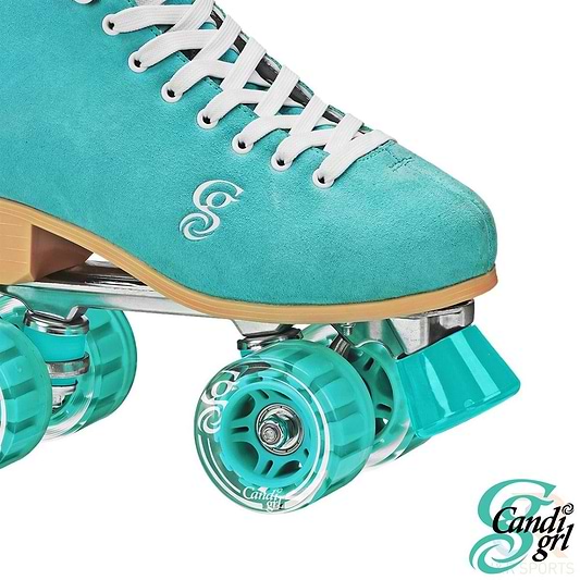 The Candi Girl Carlin Women's Quad Roller Skates in teal show off a close-up of their teal design, complete with white laces and matching teal wheels. The skates display the "Candi Grl" logo on the side, have transparent teal outdoor polyurethane wheels, and feature a teal toe stop. The brand name "Candi Grl" can be spotted in the corner.