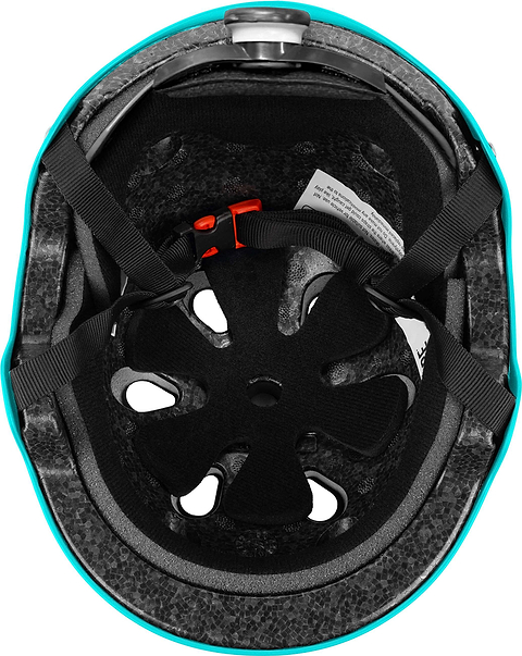 A look inside the CORE Action Sports Skate / Scooter Helmet in teal, featuring black lightweight EPS foam padding, ventilation holes, adjustable straps, and a red buckle.