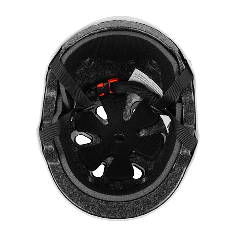 Top view of the CORE Action Sports Skate / Scooter Helmet - White by CORE, showing foam padding, ventilation holes, adjustable black straps, and a red buckle for comfort and style.