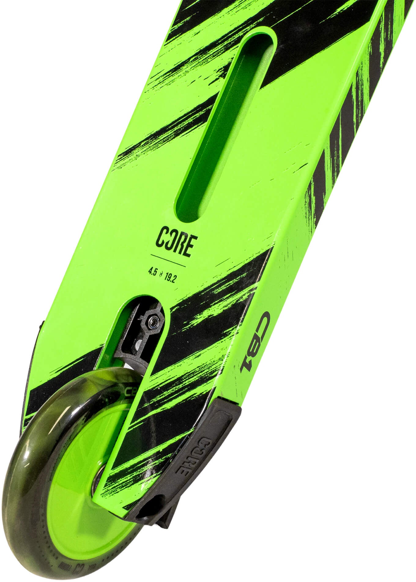 A close-up of the CORE CB1 Beginner Complete Stunt Scooter in Black / Green shows a neon green deck with bold black diagonal stripes and the "CORE" logo displayed near the rear wheel. The dark scooter wheel is partially visible at the bottom left. Designed for young riders, this beginner stunt scooter combines style and durability from the trusted brand CORE.