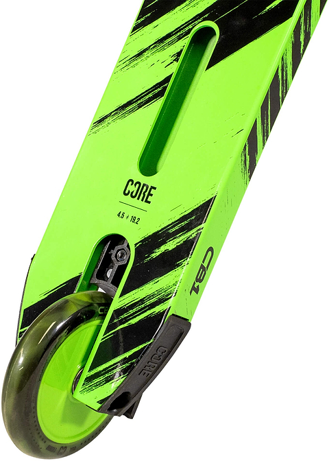 A close-up of the CORE CB1 Beginner Complete Stunt Scooter in Black / Green shows a neon green deck with bold black diagonal stripes and the "CORE" logo displayed near the rear wheel. The dark scooter wheel is partially visible at the bottom left. Designed for young riders, this beginner stunt scooter combines style and durability from the trusted brand CORE.