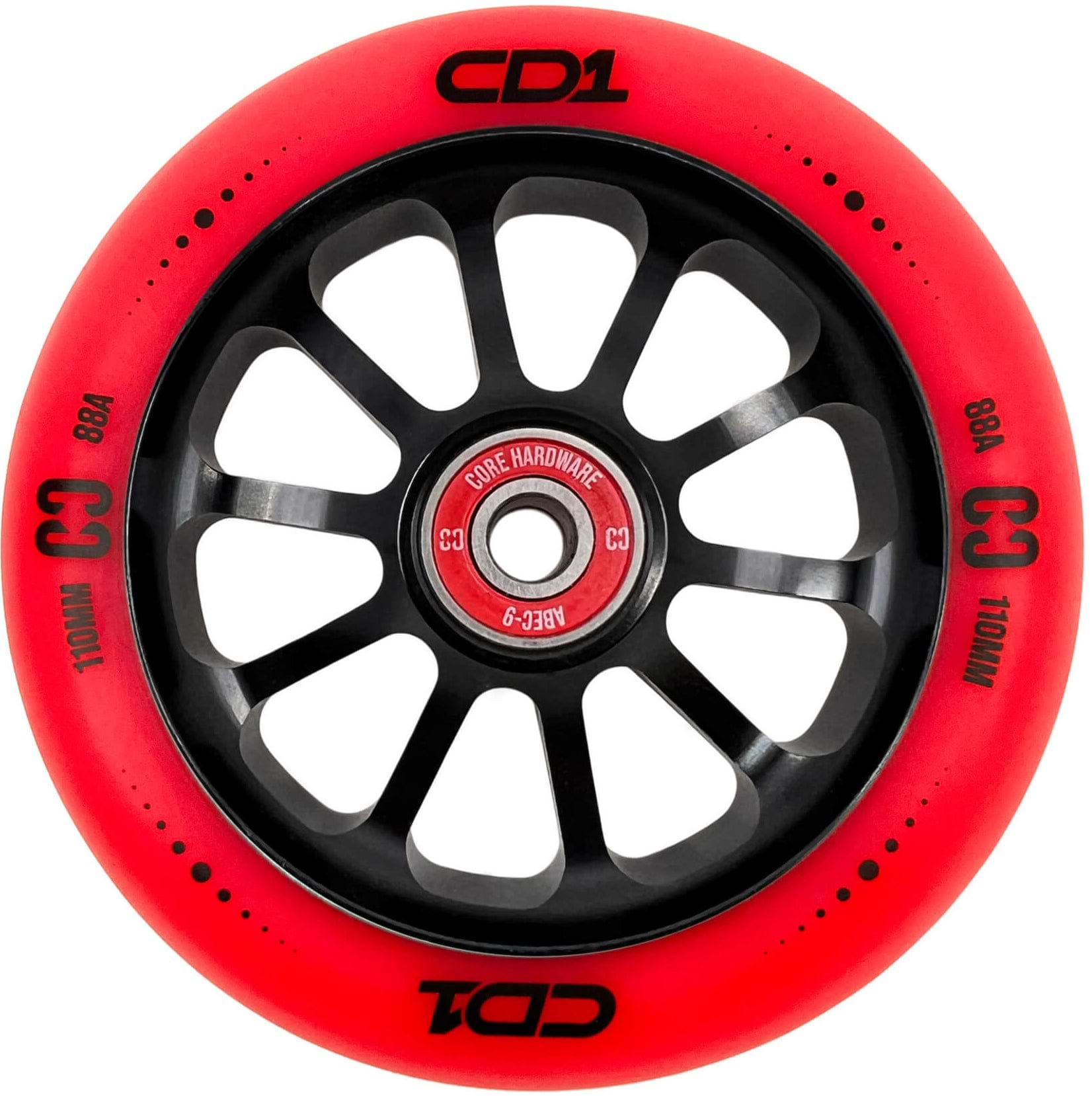 A close-up of the CORE CD1 110mm Stunt Scooter Wheel in red/black, featuring "CD1," "C3," "88A," and "110MM" on the rim plus CORE ABEC 9 bearings—perfect for your next trick scooter upgrade.
