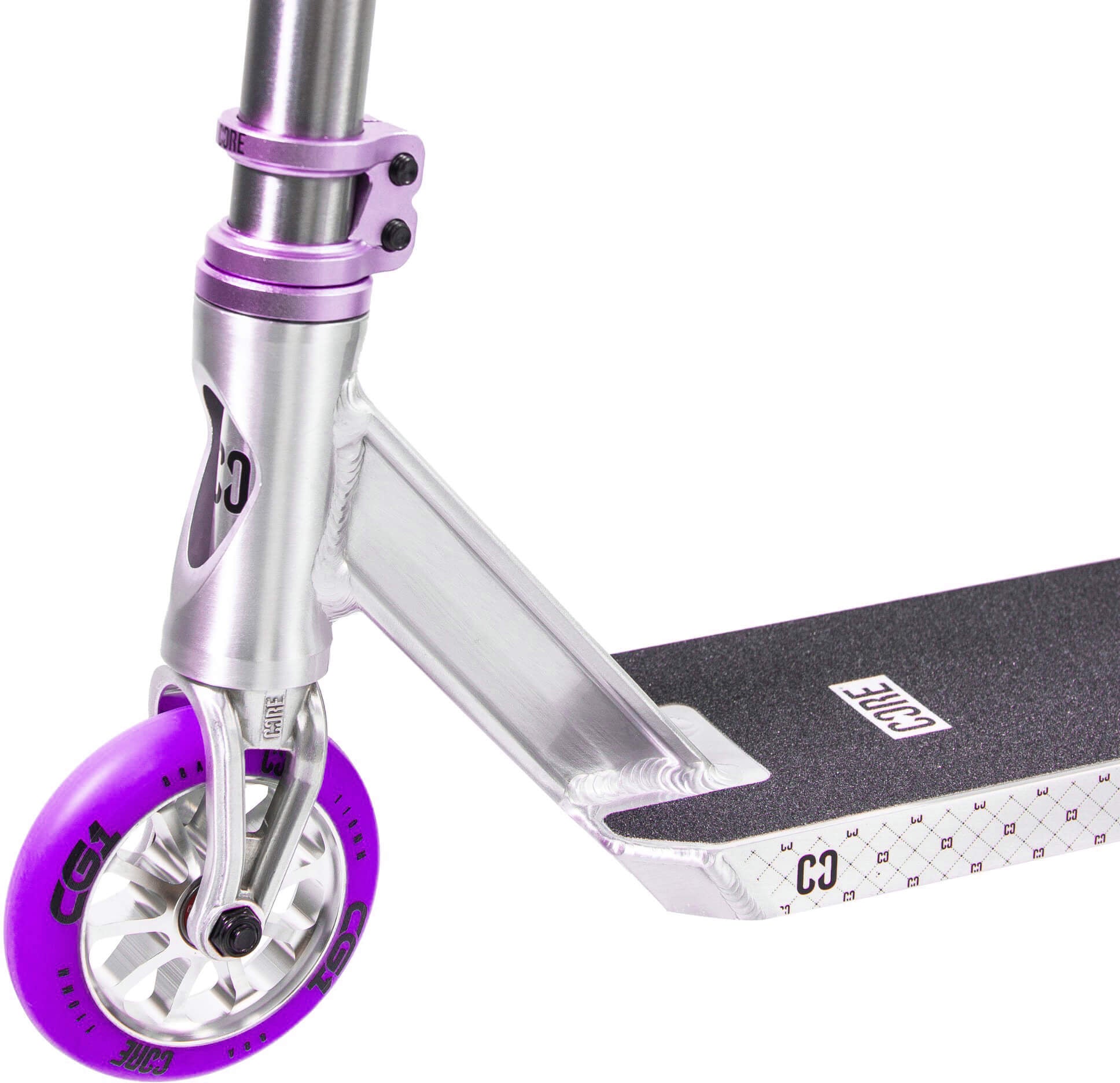 Close-up of the CORE CG1 Complete Stunt Scooter by CORE in Raw/Purple, featuring a silver finish with a purple wheel, black grip tape on the deck, and matching purple clamp and accents—perfect as a kids’ trick scooter or an ideal stunt scooter for beginners.