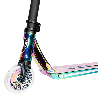 Close-up of the CORE CL1 Complete Stunt Scooter's front section, showcasing its shiny neochrome finish. The clear wheel displays a geometric pattern on the hub, and the deck shines with similar metallic hues. Premium aftermarket parts, such as nylon box ends from CORE, enhance its performance.