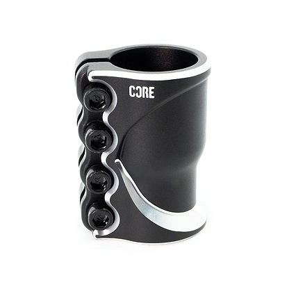The CORE Cobra 4 Bolt Oversized SCS Stunt Scooter Clamp in black, built from durable Cold Forged Aluminium 6061, includes four side bolts to securely attach components like handlebars. Its lightweight design with sleek curves prominently displays the "CORE" logo on the upper part, offering a contemporary look.