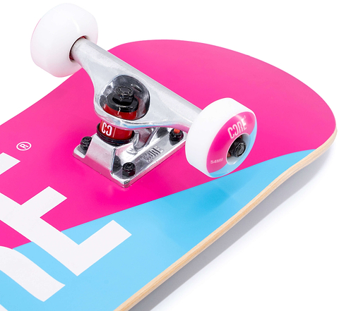 Close-up of a CORE C2 Pink / Blue Split Complete Skateboard - 7.75″ x 31″ featuring a pink and blue split maple deck, silver metal trucks, and white wheels.
