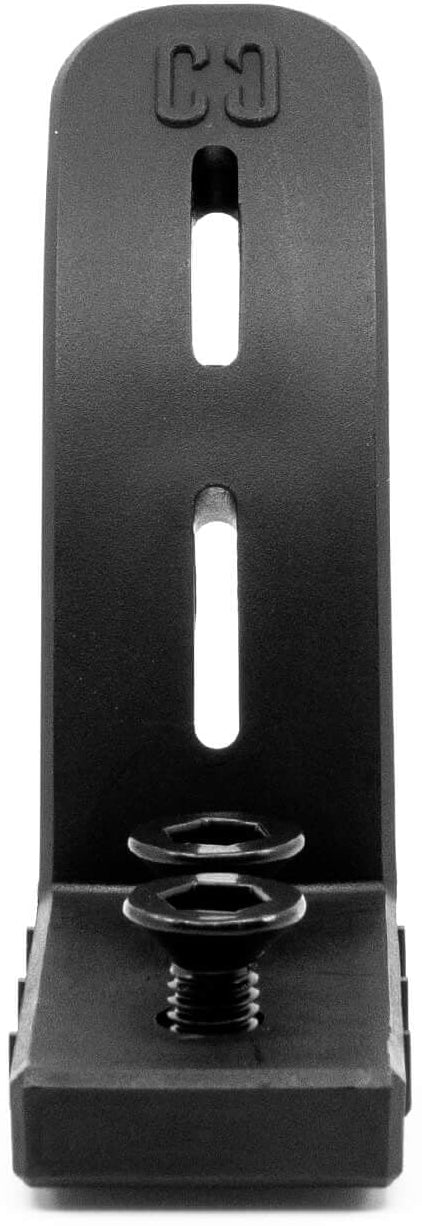 The CORE Dual Nylon Stunt Scooter Brake - Black by CORE is a black nylon brake with two vertical slots and a screw at the base, designed for mounting or securing stunt scooter brakes or dual brake systems.