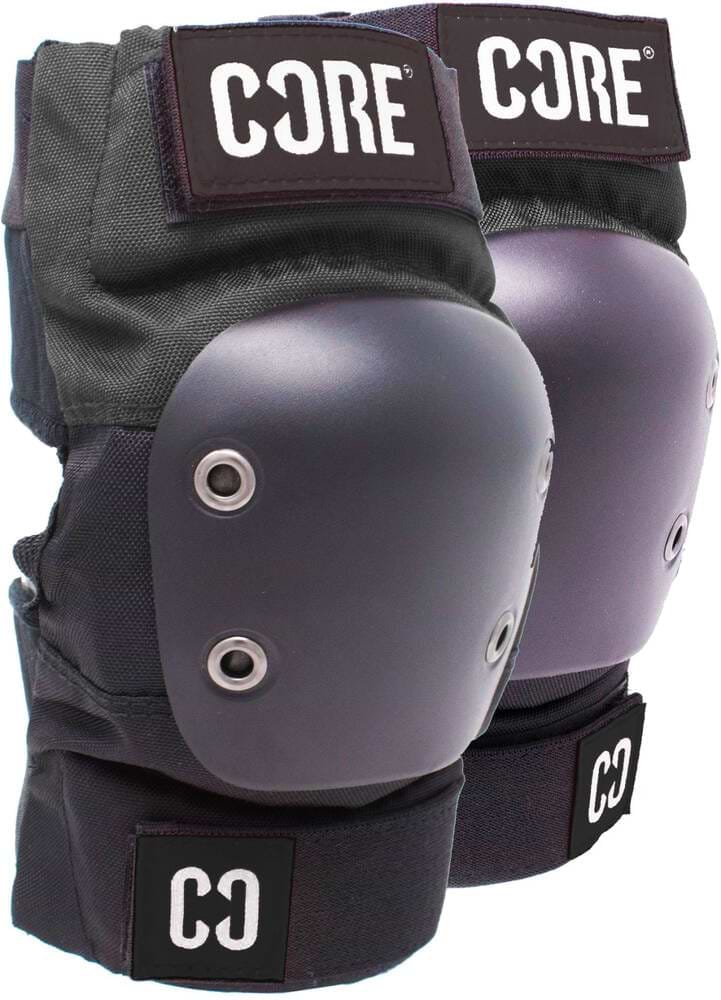 The CORE Pro Elbow Skate Protection Pads in black and grey, featuring hard protective shells and metal rivets, offer complete support alongside matching knee pads. The "CORE" brand is displayed prominently on top, with a "CO" logo on the strap. These pads are ideal for ensuring safety during skateboarding or scootering.