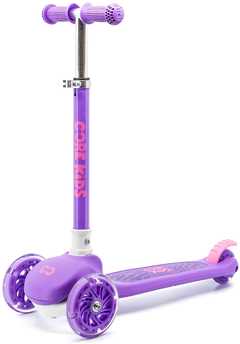 The CORE Foldy 3 Wheel Kids Scooter - Purple by CORE features “CORE KIDS” on the upright handlebar stem, pink accents, and a foot brake over the rear wheel. Its lean-to-steer design helps young riders balance and turn safely.
