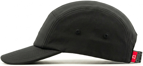 The CORE Performance Cap - Black / Reflective by CORE is crafted from breathable fabric, featuring two small side eyelets and a red adjustable strap at the back. It is presented in a side profile view on a white background.